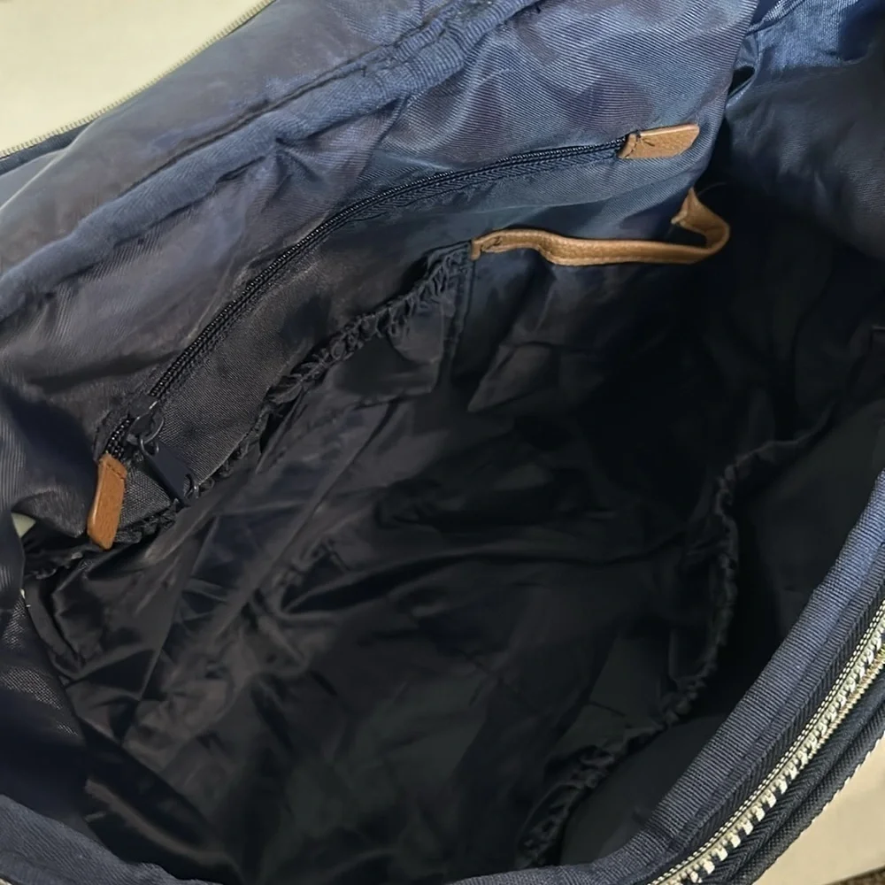 Bananafish breast pump/diaper backpack navy and white pin stripes